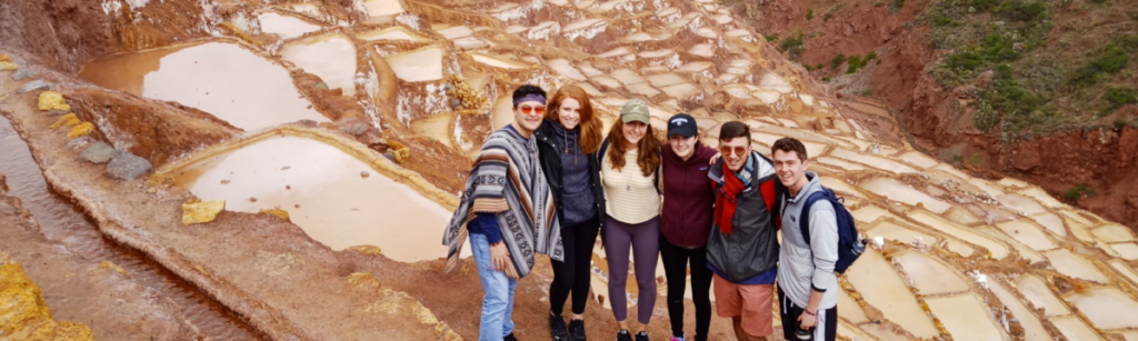 students standing in the salt mines of cuzco peru