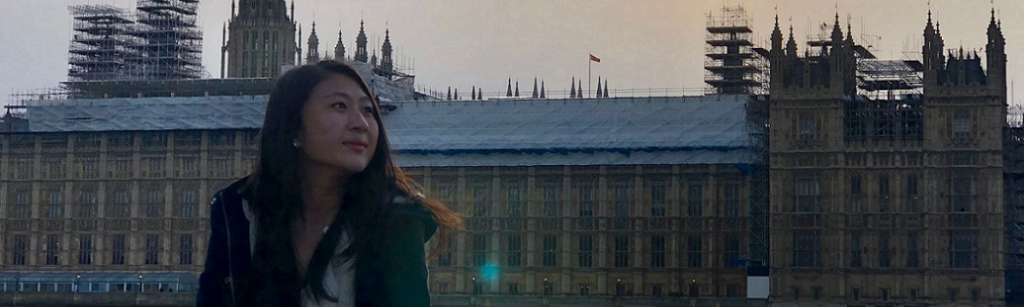 student in front of a building in london